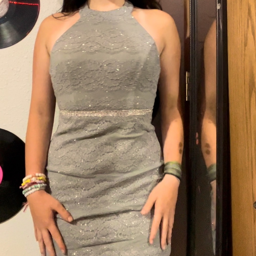 silver sparkly halter top formal dress with an open back